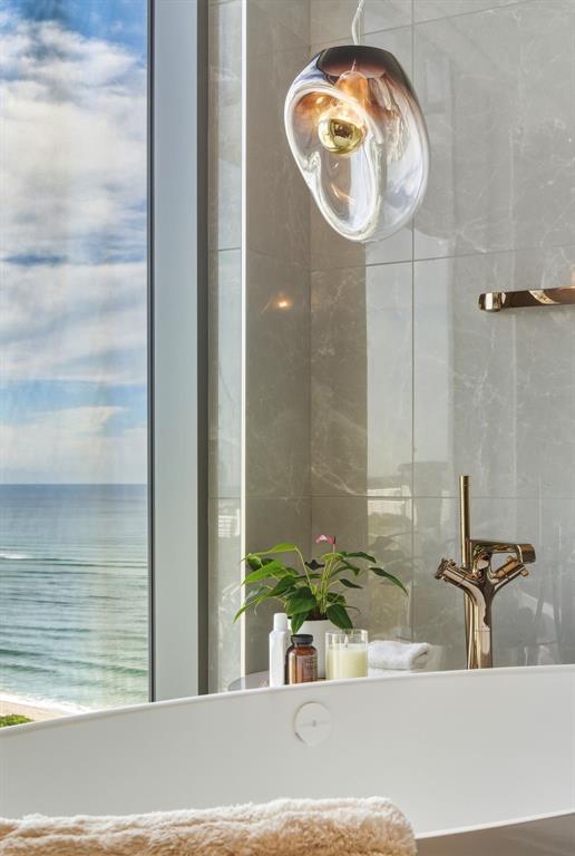 1116 North Ocean Boulevard, Unit 1506 Pompano Beach, FL 33062 - Photo 23 of 69 a bathroom with a granite countertop sink and a mirror