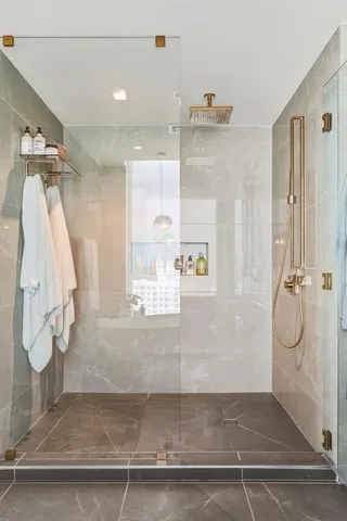 a living room with a bed furniture and a window