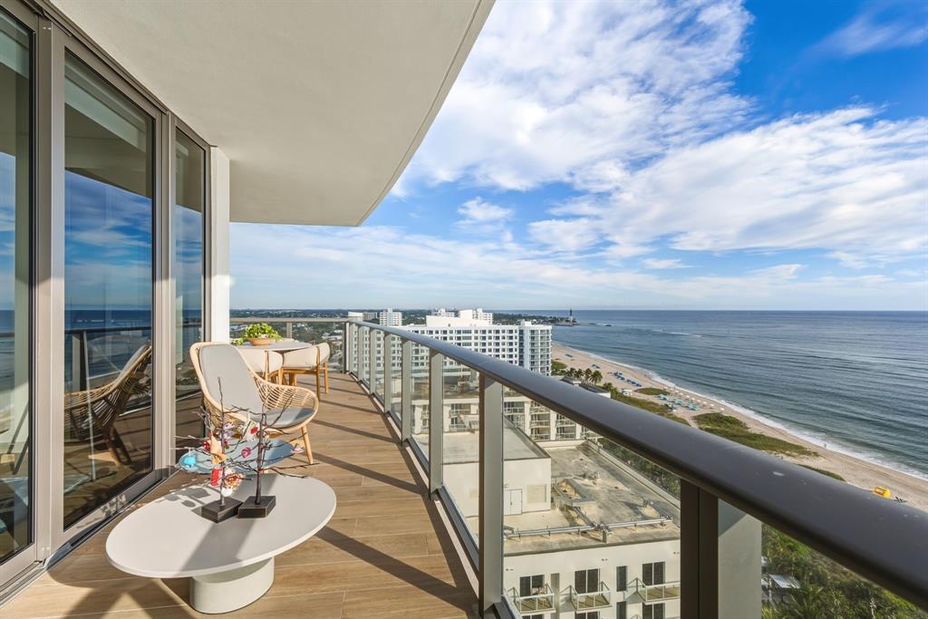 1116 North Ocean Boulevard, Unit 1506 Pompano Beach, FL 33062 - Photo 27 of 69 a balcony with table and chairs