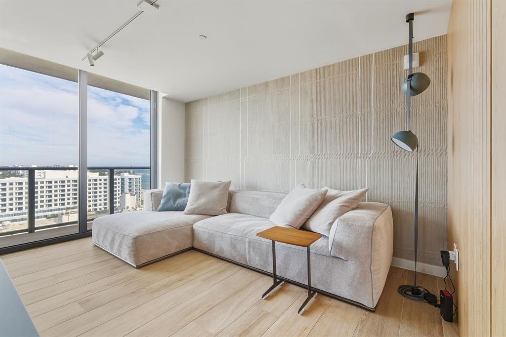 1116 North Ocean Boulevard, Unit 1506 Pompano Beach, FL 33062 - Photo 29 of 69 a bedroom with a bed and a large window