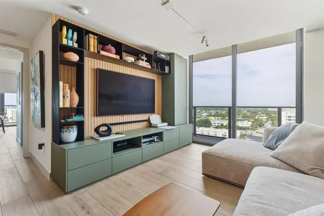 a living room with furniture and a window