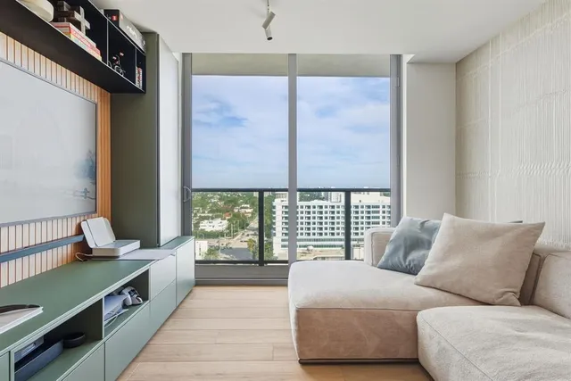 a bedroom with bed and a table