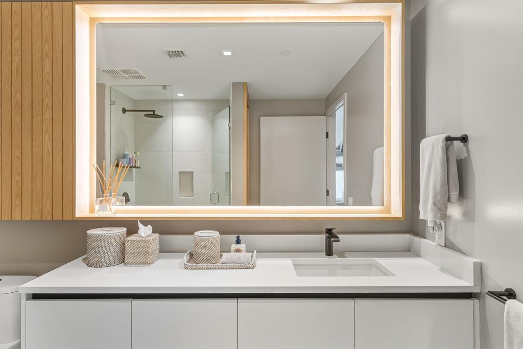 1116 North Ocean Boulevard, Unit 1506 Pompano Beach, FL 33062 - Photo 36 of 69 a bathroom with a sink and a mirror