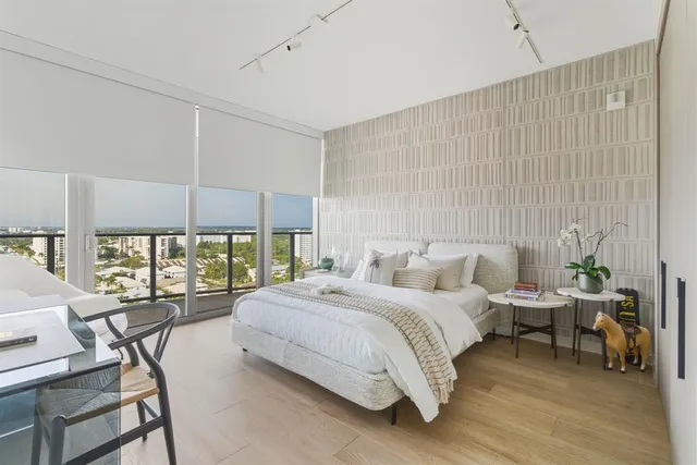 a bedroom with a bed and a view of bathroom