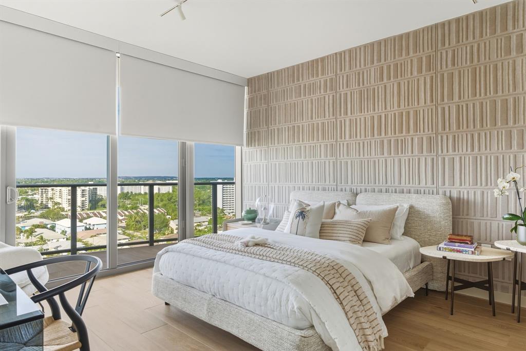 1116 North Ocean Boulevard, Unit 1506 Pompano Beach, FL 33062 - Photo 38 of 69 a bedroom with a bed and a large window