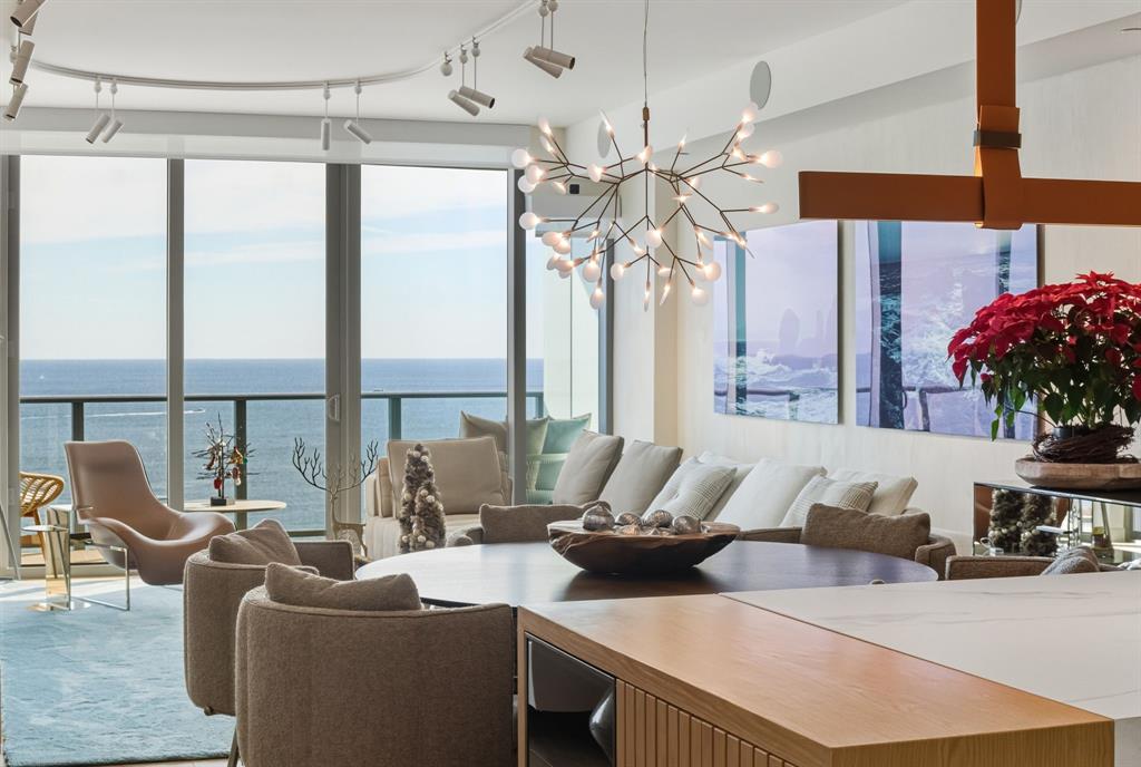 1116 North Ocean Boulevard, Unit 1506 Pompano Beach, FL 33062 - Photo 4 of 69 a living room with furniture and a large window