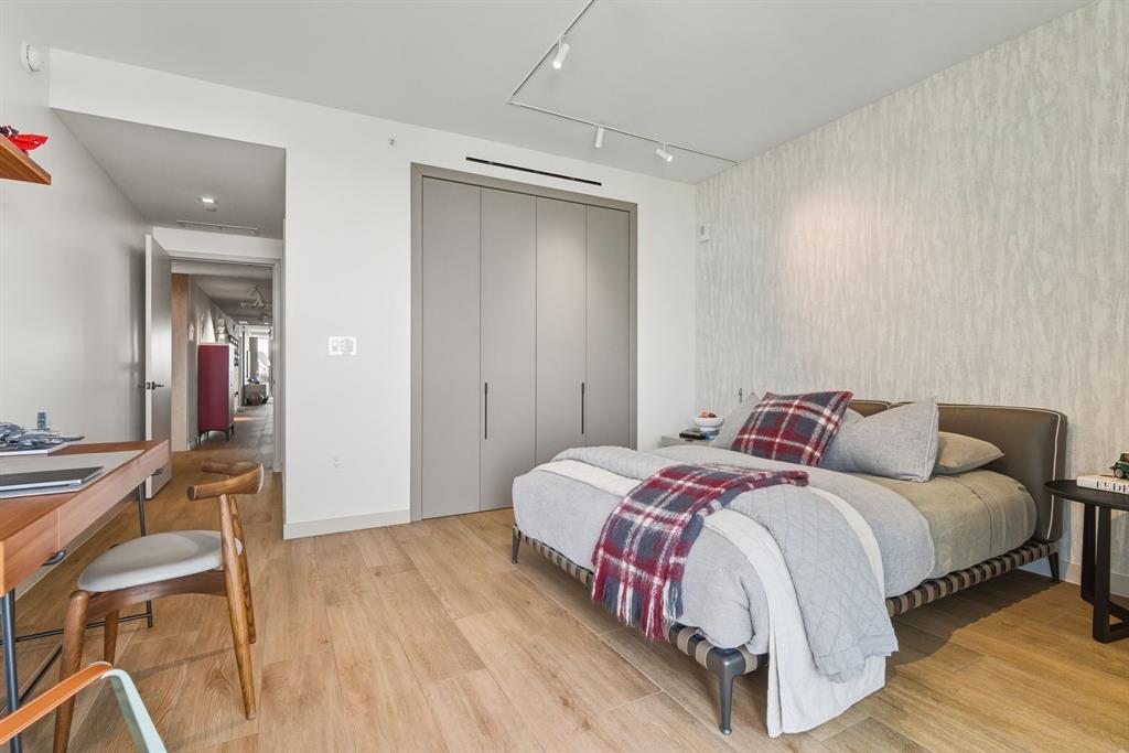 1116 North Ocean Boulevard, Unit 1506 Pompano Beach, FL 33062 - Photo 47 of 69 a bedroom with a bed and a view of bathroom