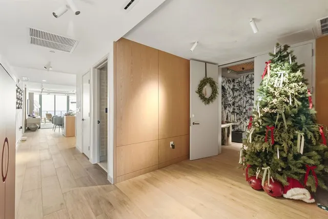 a living room with patio furniture and a large window