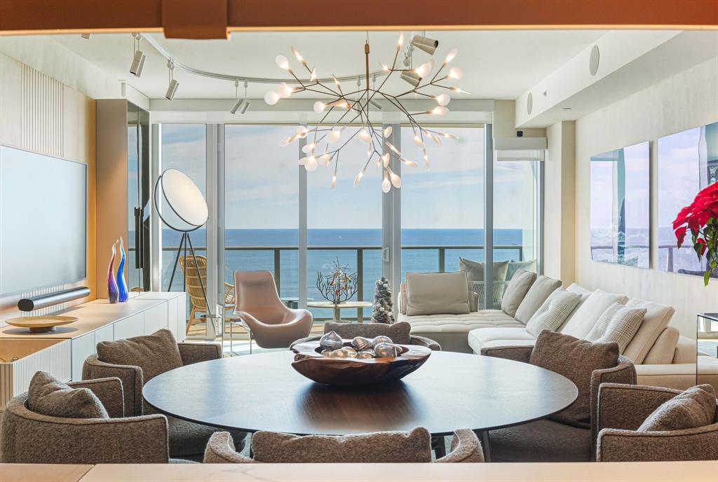 1116 North Ocean Boulevard, Unit 1506 Pompano Beach, FL 33062 - Photo 5 of 69 a living room with furniture and a large window