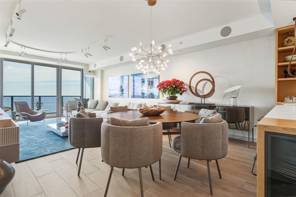 1116 North Ocean Boulevard, Unit 1506 Pompano Beach, FL 33062 - Photo 6 of 69 a living room with fireplace furniture and a large window