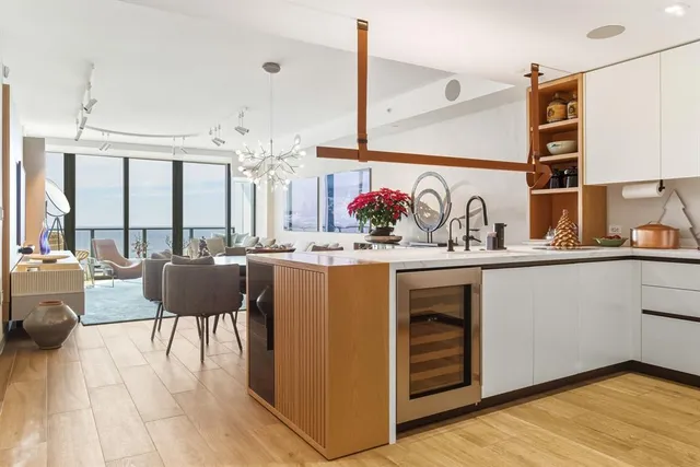 a kitchen with a refrigerator and a sink