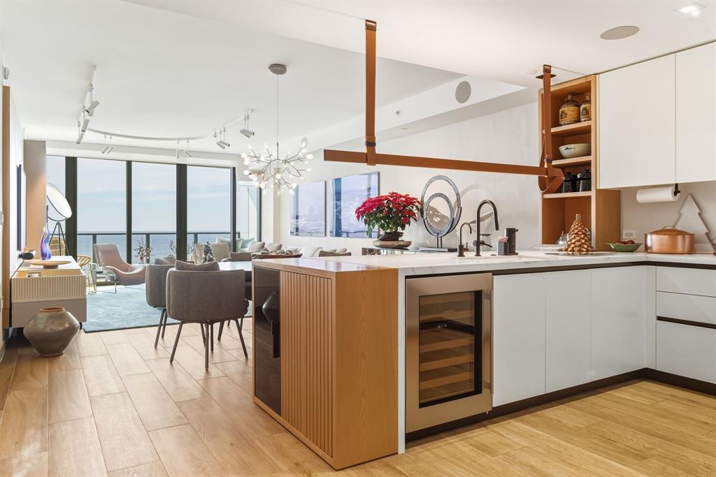 1116 North Ocean Boulevard, Unit 1506 Pompano Beach, FL 33062 - Photo 7 of 69 a kitchen with a refrigerator and a sink