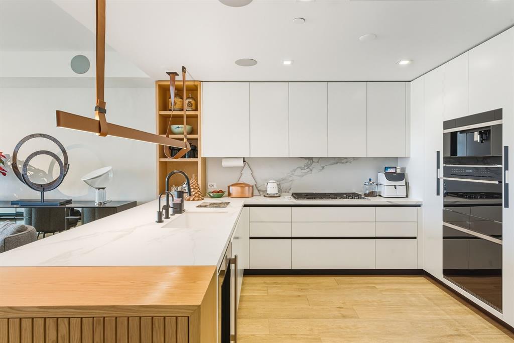1116 North Ocean Boulevard, Unit 1506 Pompano Beach, FL 33062 - Photo 9 of 69 a kitchen with a stove a sink and a refrigerator