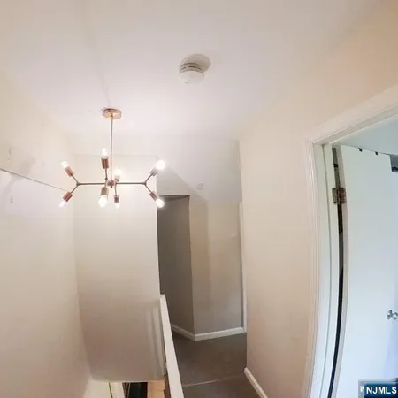 a bathroom with a sink a toilet a tub and a window