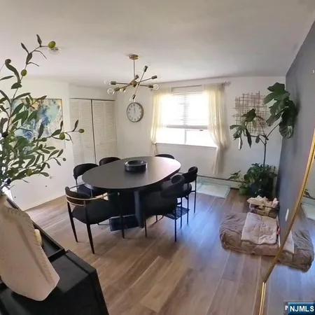 a table and chairs in a blue room
