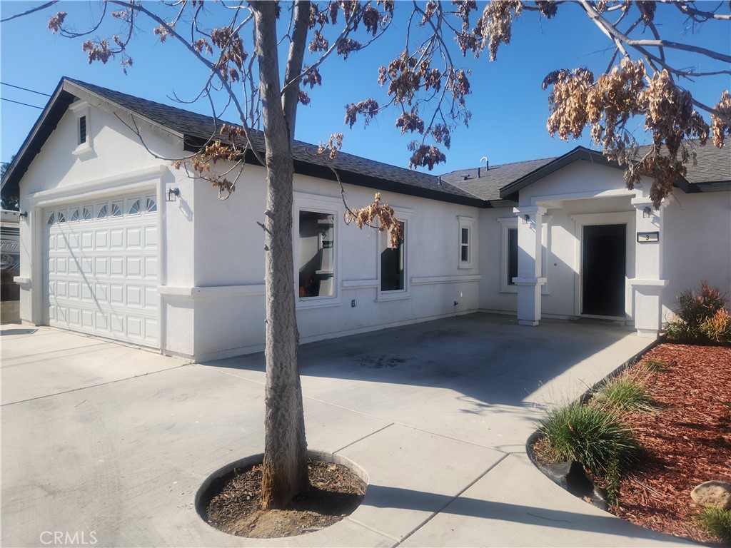 12690 7th Street Yucaipa, CA 92399 - Photo 2 of 7 a front view of a house with garden