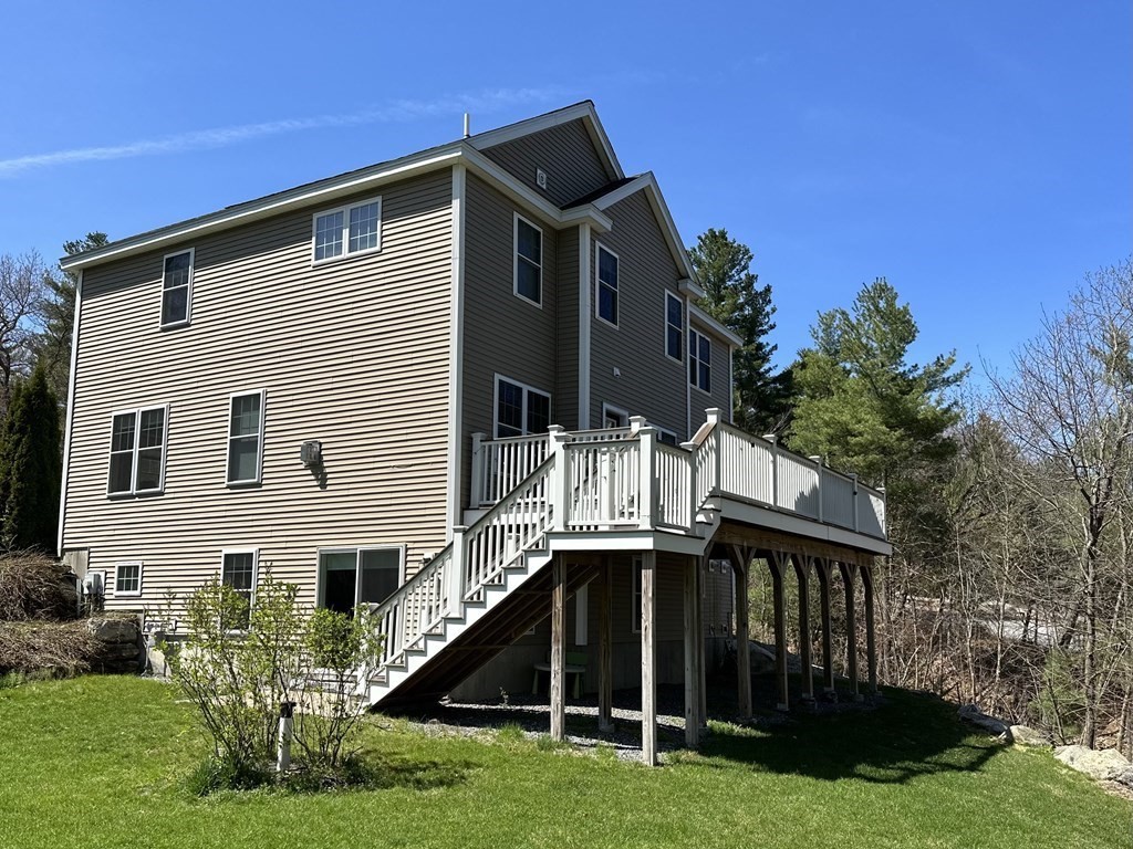 47 Quarry Road, Unit 47 Acton, MA 01720 - Photo 13 of 15 a front view of house with yard and green space