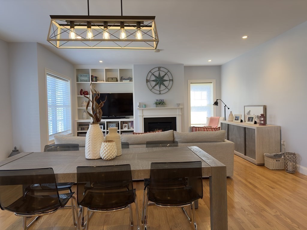 47 Quarry Road, Unit 47 Acton, MA 01720 - Photo 6 of 15 a view of a dining room with furniture and a fireplace