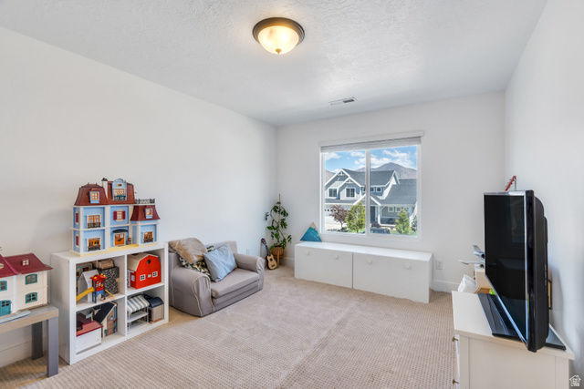 646 South Meade Street Mapleton, UT 84664 - Photo 14 of 46 Carpeted room with a flush-mount ceiling light and a large window