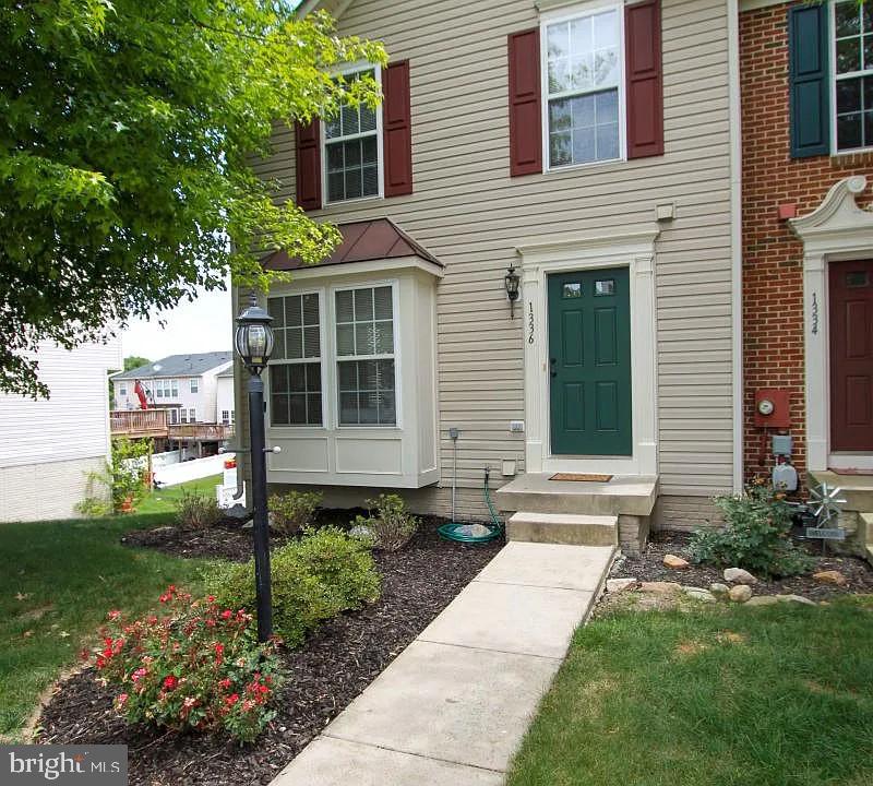 1336 Steed Street Ranson, WV 25438 - Photo 2 of 15 a front view of a house with a yard