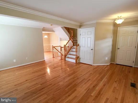 1336 Steed Street Ranson, WV 25438 - Photo 5 of 15 a view of an empty room with wooden floor and stairs