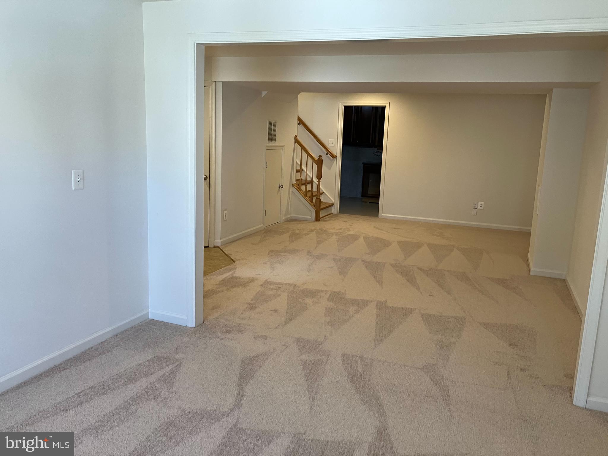 1336 Steed Street Ranson, WV 25438 - Photo 8 of 15 a view of an empty room with wooden floor and a window