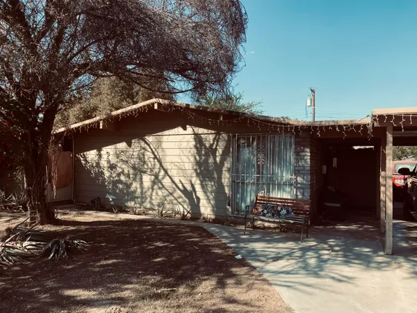 a view of a house with a tree