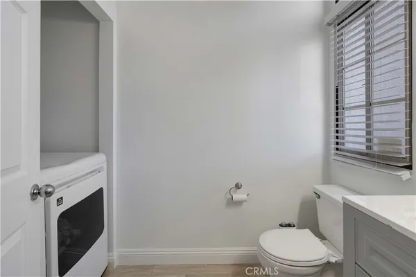 a bathroom with a toilet and a sink