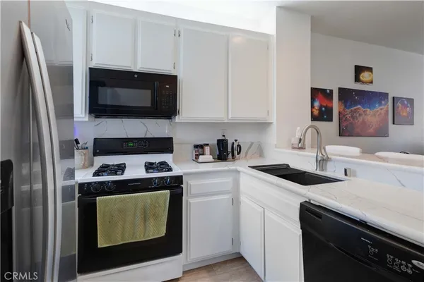 a kitchen with a stove and a microwave