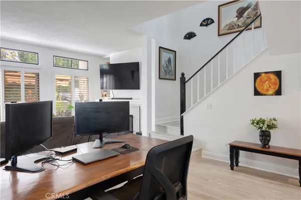 a view of a workspace with furniture