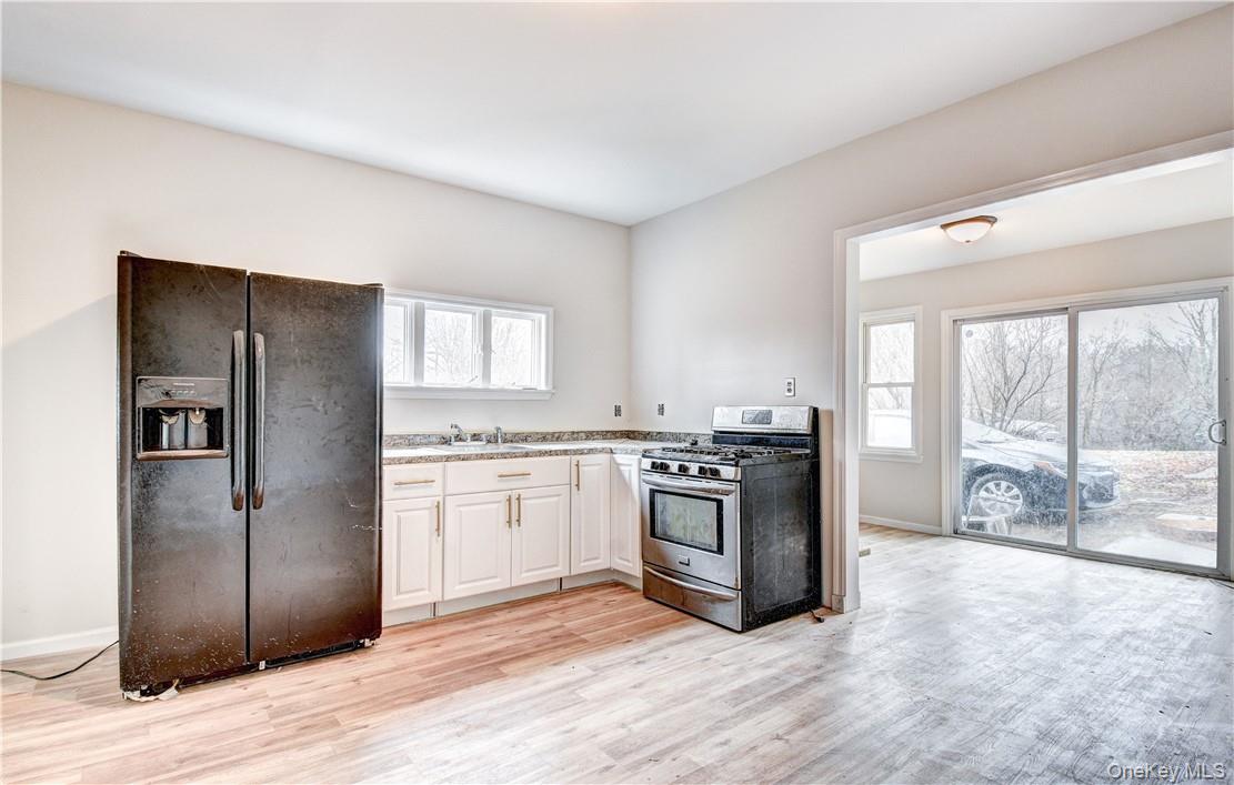 202 Midland Lake Road Middletown, NY 10941 - Photo 1 of 26 a kitchen with stainless steel appliances granite countertop a refrigerator stove and sink