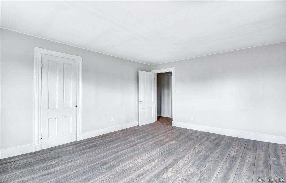 202 Midland Lake Road Middletown, NY 10941 - Photo 13 of 26 a view of an empty room with wooden floor