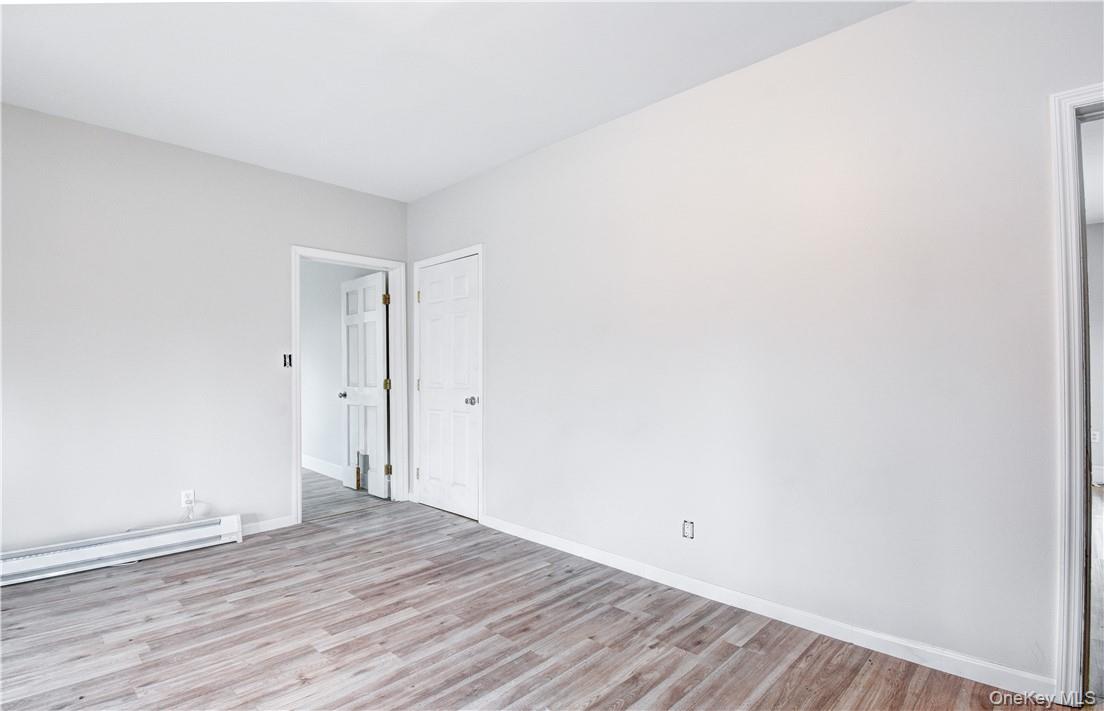 202 Midland Lake Road Middletown, NY 10941 - Photo 4 of 26 a view of an empty room with wooden floor