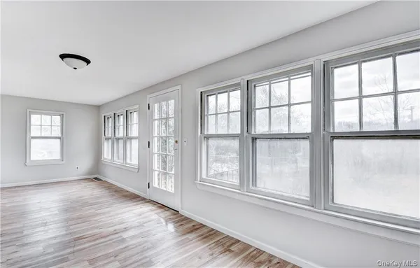 a view of an empty room with a window