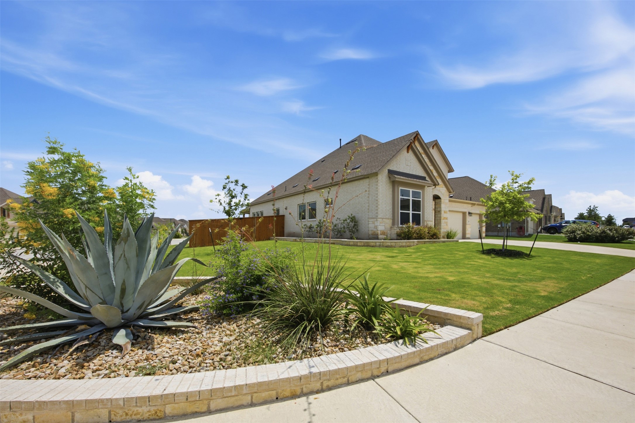 2101 Little Snake Way Georgetown, TX 78633 - Photo 3 of 37 Mature landscaping and verdant lawns welcome you to this charming single-story residence.