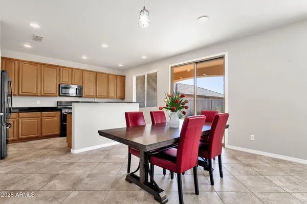 a kitchen with granite countertop wooden cabinets and stainless steel appliances