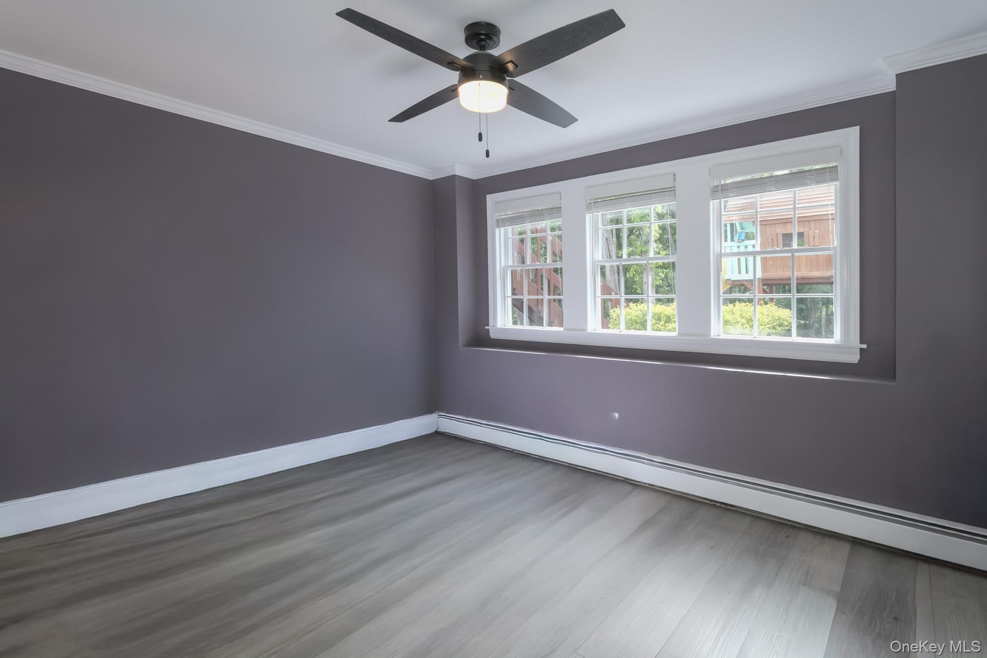 102 Beverly Road Chester, NY 10918 - Photo 43 of 49 a view of a room with wooden floor and windows