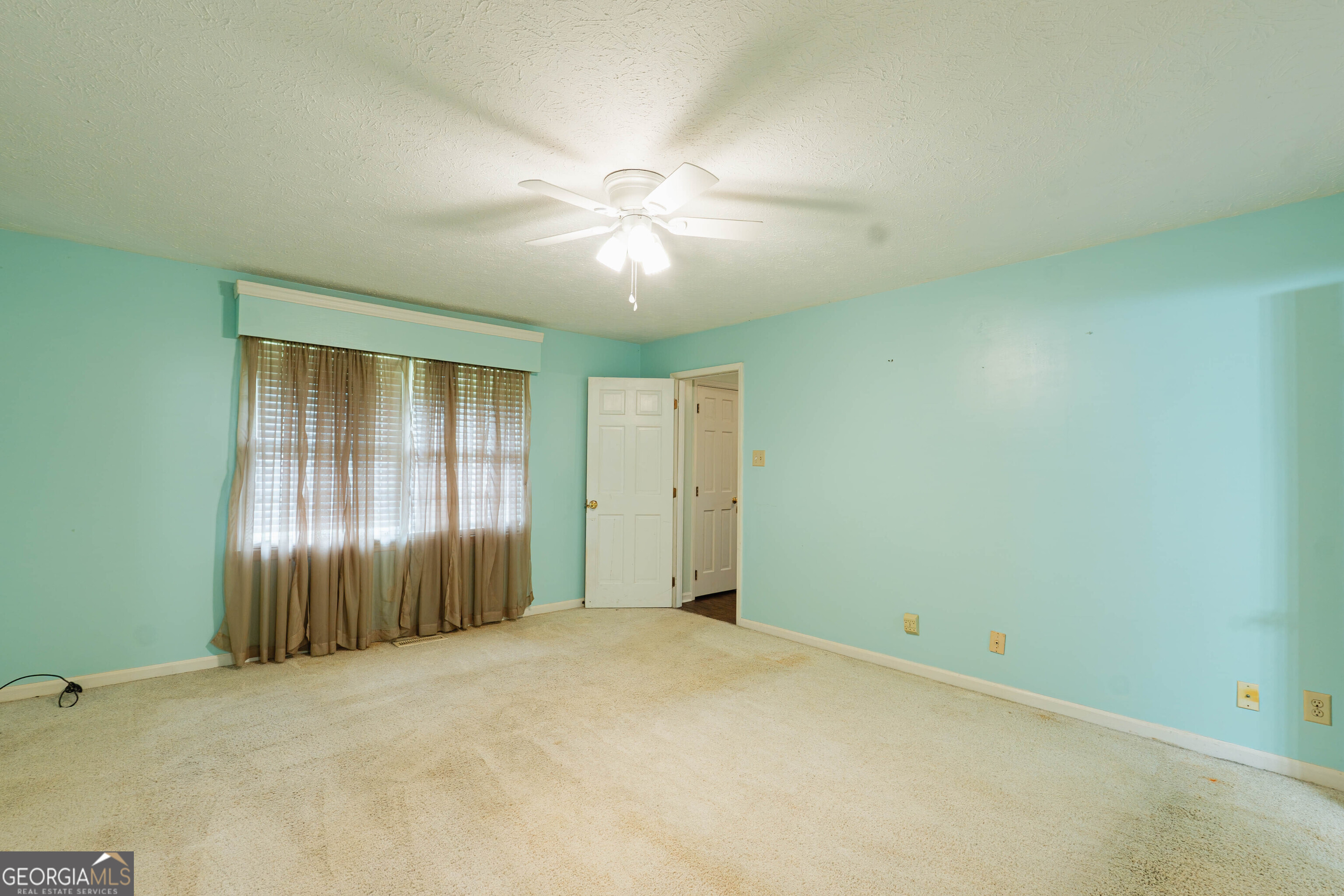 139 Cords Bridge Road Northeast Milledgeville, GA 31061 - Photo 13 of 35 an empty room with closet and windows