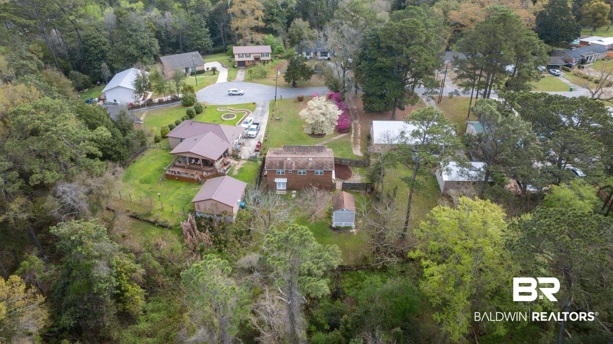 18 Lee Circle Spanish Fort, AL 36527 - Photo 42 of 50 Birds eye view of property featuring a forest view