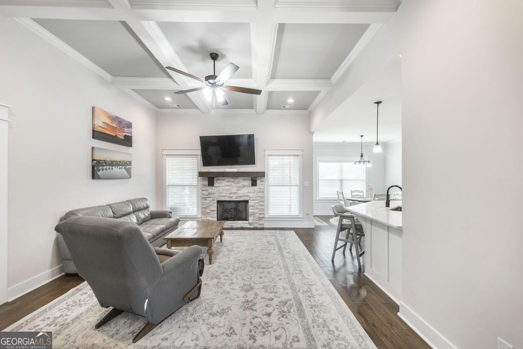 113 Flat Rock Lane Perry, GA 31069 - Photo 12 of 39 a living room with furniture a fireplace and a flat screen tv