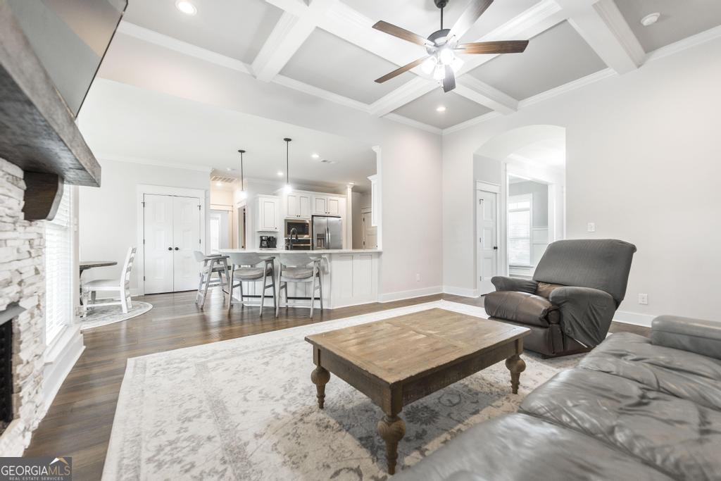 113 Flat Rock Lane Perry, GA 31069 - Photo 13 of 39 a living room with furniture a table and kitchen view
