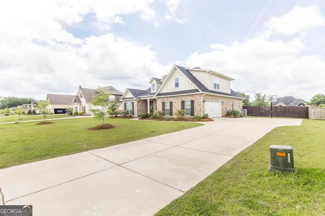 a front view of a house with a yard