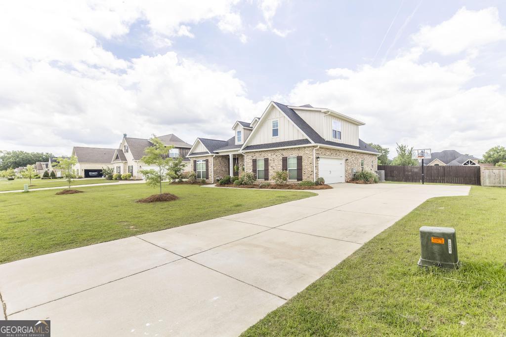 113 Flat Rock Lane Perry, GA 31069 - Photo 2 of 39 a front view of a house with a yard