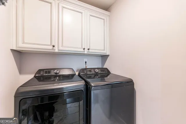 a kitchen with a stove and cabinets