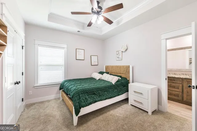 a bedroom with a bed dresser and a window