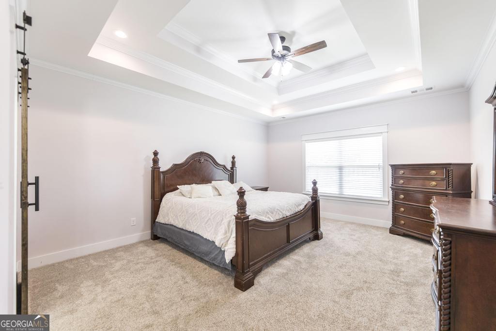 113 Flat Rock Lane Perry, GA 31069 - Photo 27 of 39 a bedroom with a bed and window