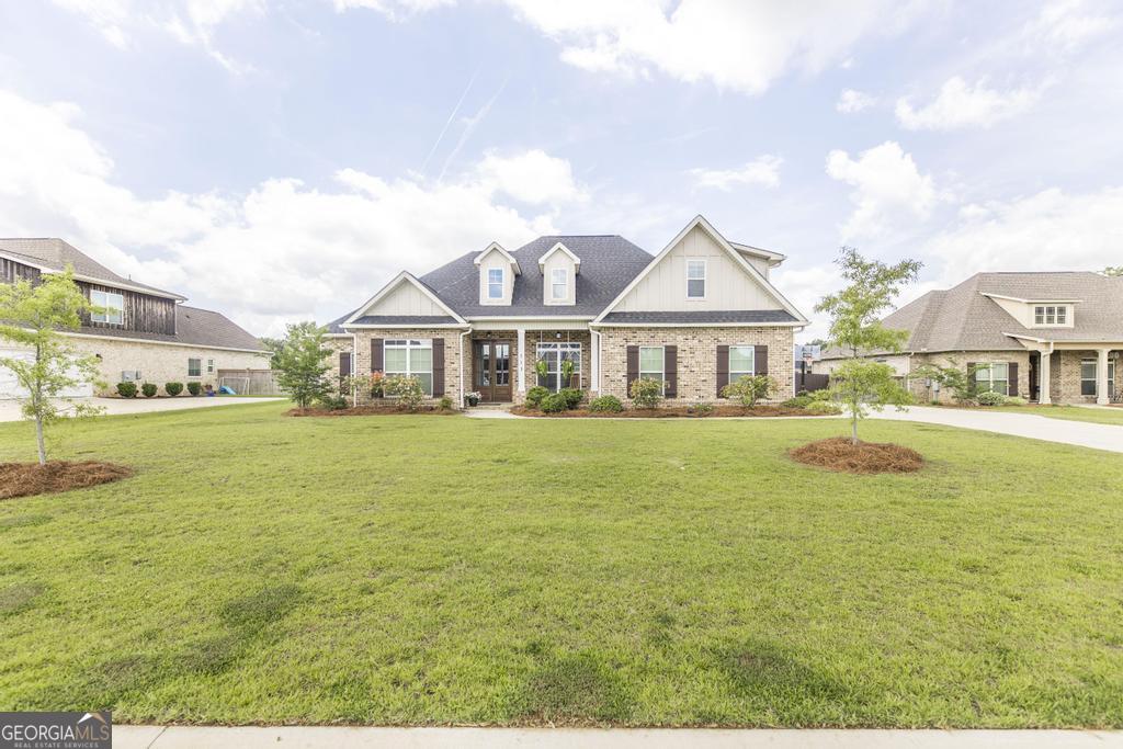 113 Flat Rock Lane Perry, GA 31069 - Photo 3 of 39 a front view of a house with swimming pool having outdoor seating