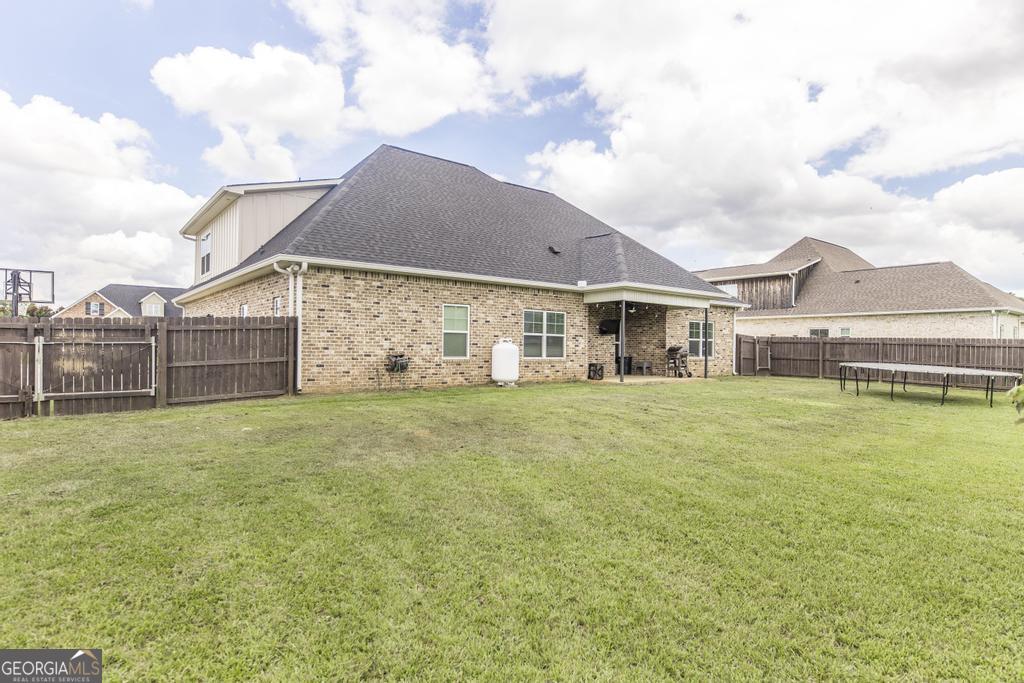 113 Flat Rock Lane Perry, GA 31069 - Photo 35 of 39 a view of a house with a garden and plants