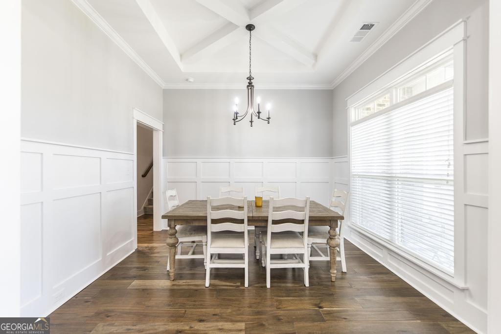 113 Flat Rock Lane Perry, GA 31069 - Photo 8 of 39 a view of a dining room with furniture and wooden floor