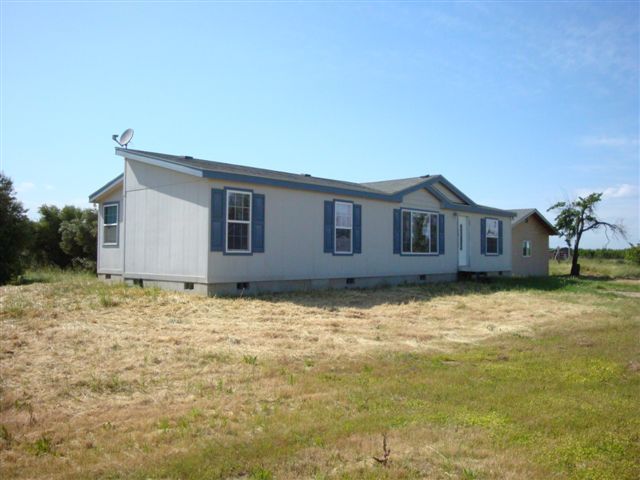 5731 State Highway 99w Corning, CA 96021 - Photo 1 of 6 a house view with a backyard space